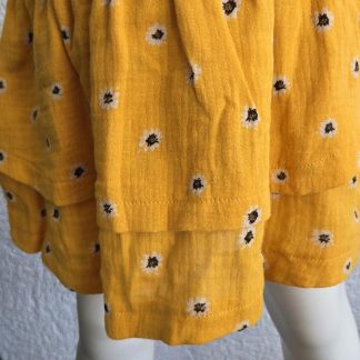 104 - Looxs rok okergeel bloemen nieuw (0326vee)